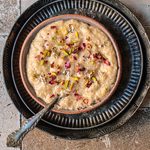 Instant Pot Seviyan Kheer, garnished with pistachios and rose petals.