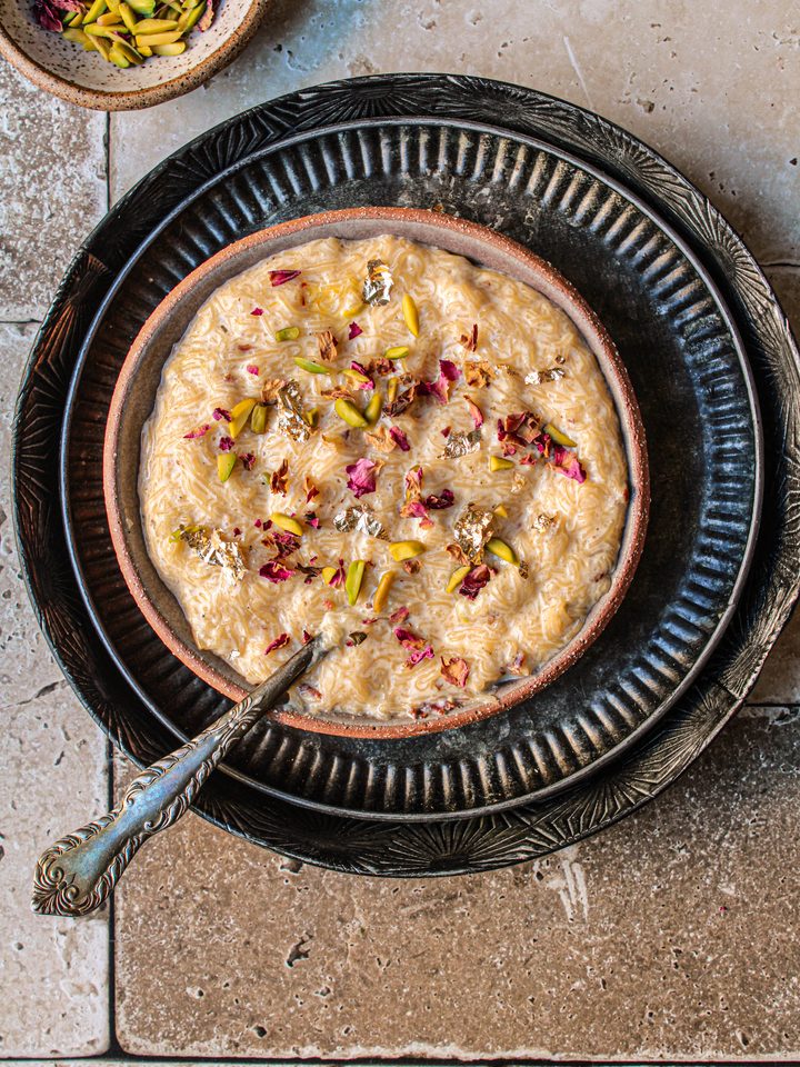 Instant Pot Seviyan Kheer, garnished with pistachios and rose petals.