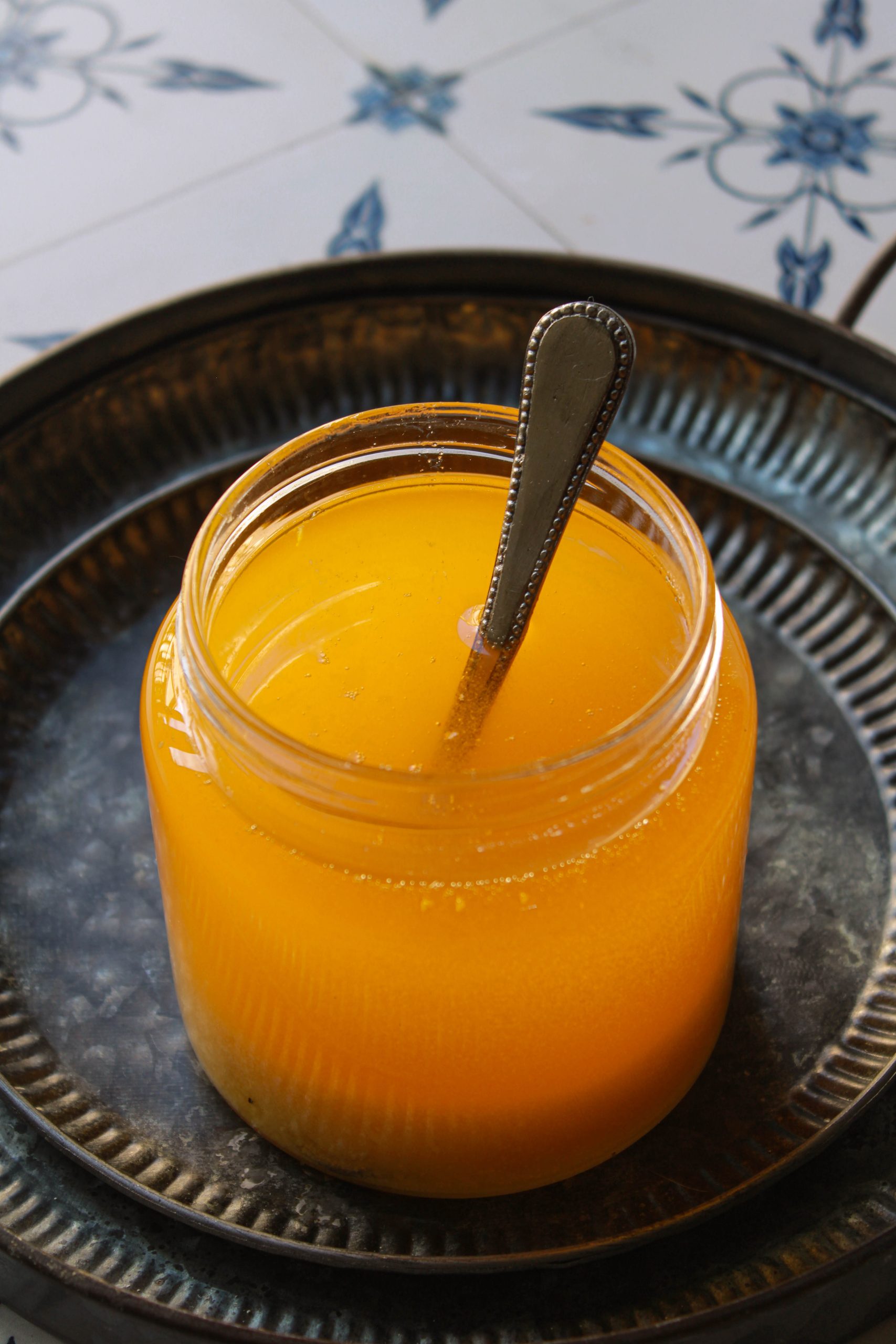 Homemade ghee in a glass jar